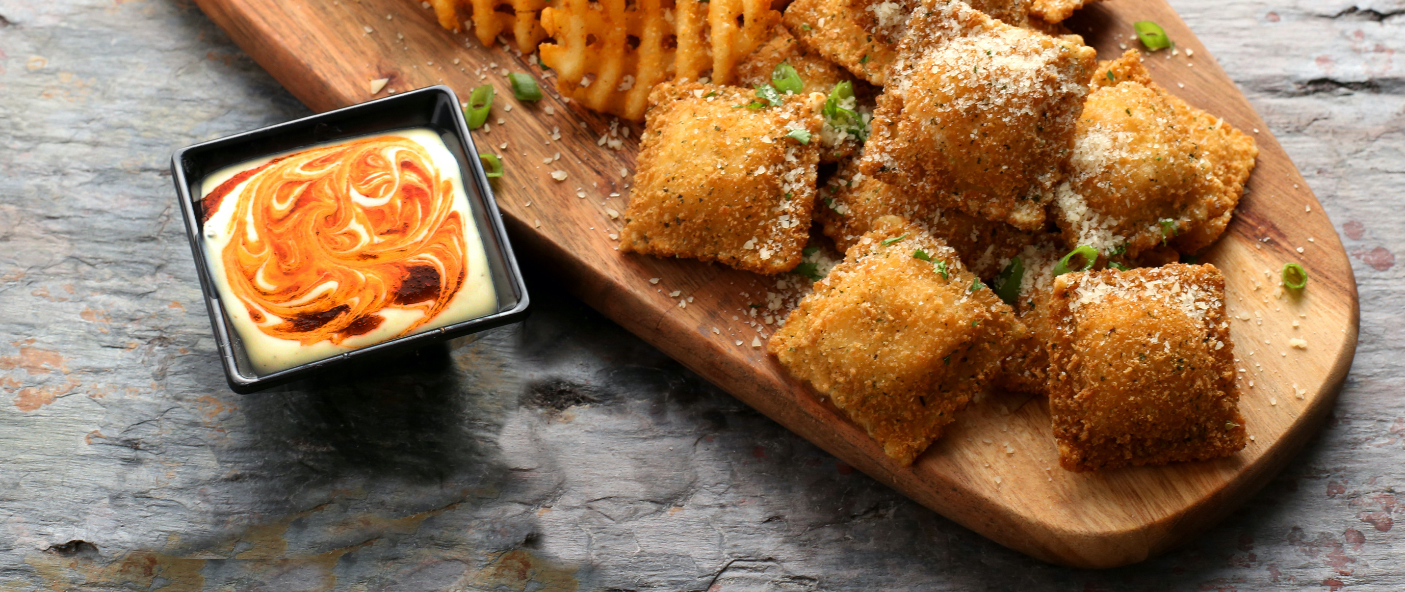 A plate of toasted appetizers with Parmesan cheese sprinkled on top. 